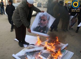 Burning pictures of Qassem Soleimani and Hassan Nasrallah in the city of Rafah, Gaza Strip